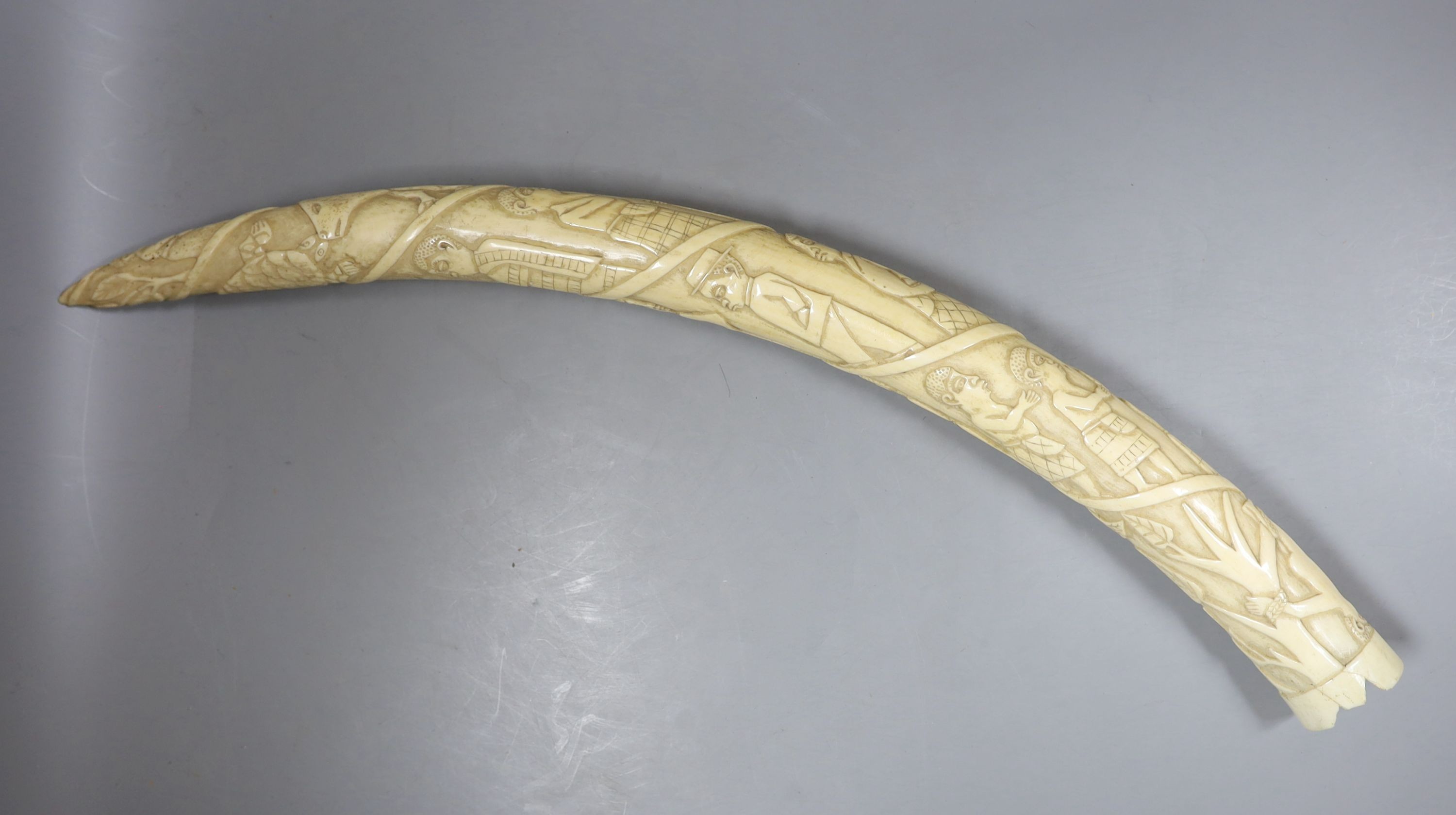 A 19th-century Luango tribal carved ivory tusk, Democratic Republic of Congo, 53 cm long